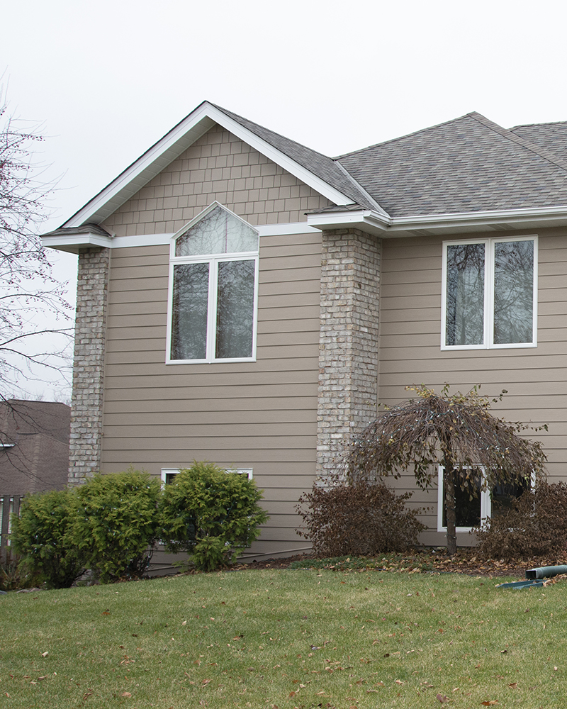 Khaki Brown James Hardie siding and Marvin replacement windows on a Lakeville MN home