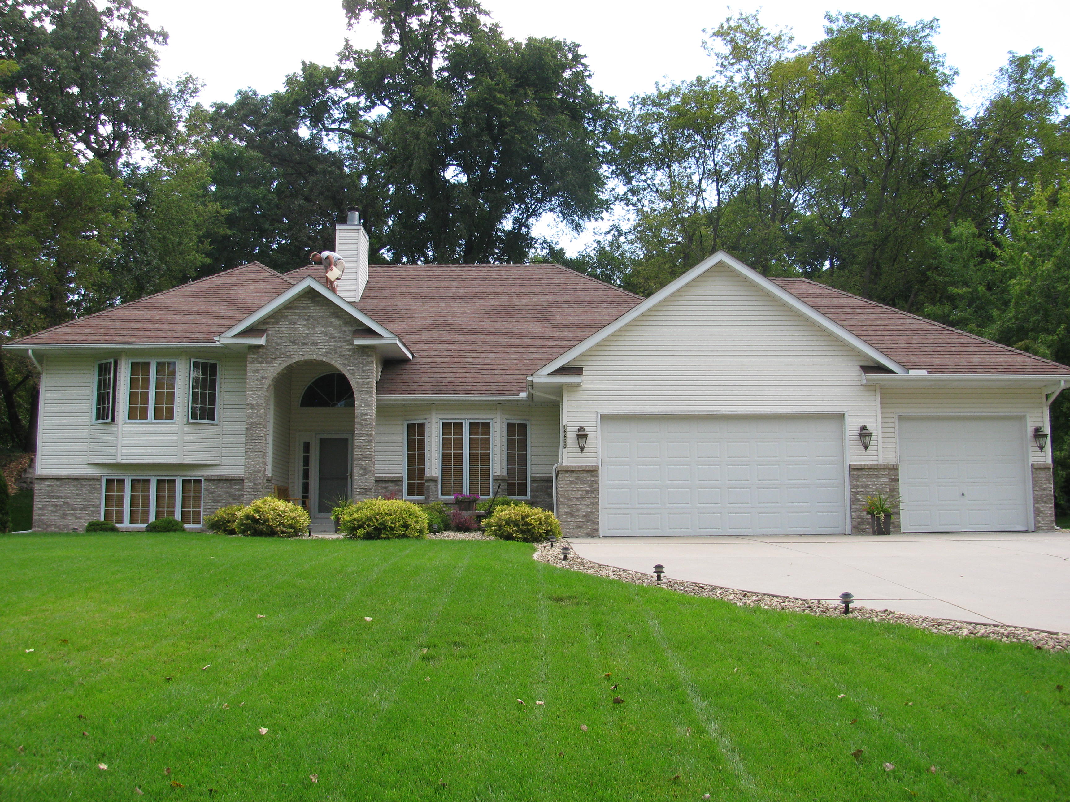 Worn three tab shingle roof before replacement in Minnetonka Minnesota