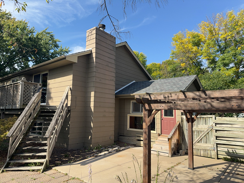 Existing chimney chase on Maple Grove home before siding and chimney reconstruction