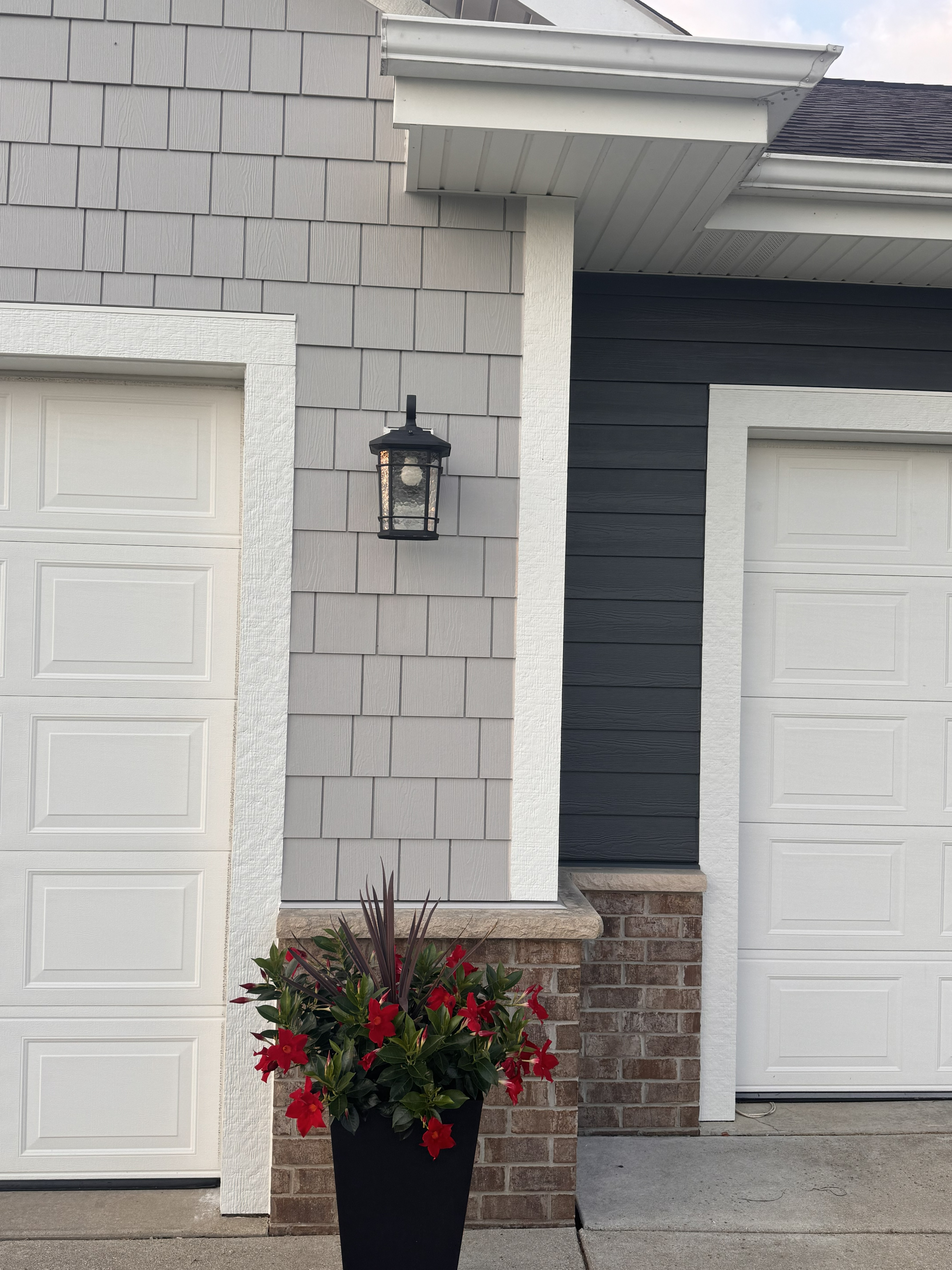James Hardie Pearl Gray shakes and Iron Gray lap siding detail on Muskego WI home