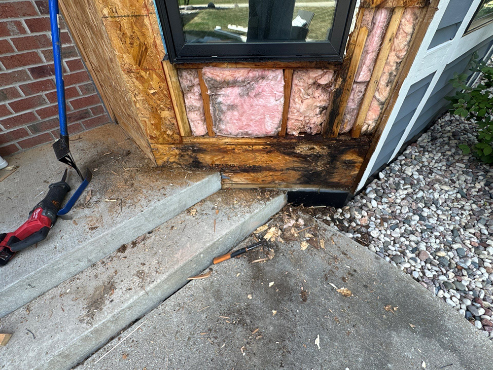 Deteriorated sheathing and framing exposed during Brookfield siding replacement