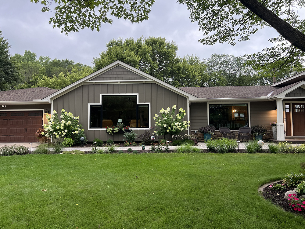Circle Pines home with Timber Bark James Hardie siding, Marvin windows and custom portico